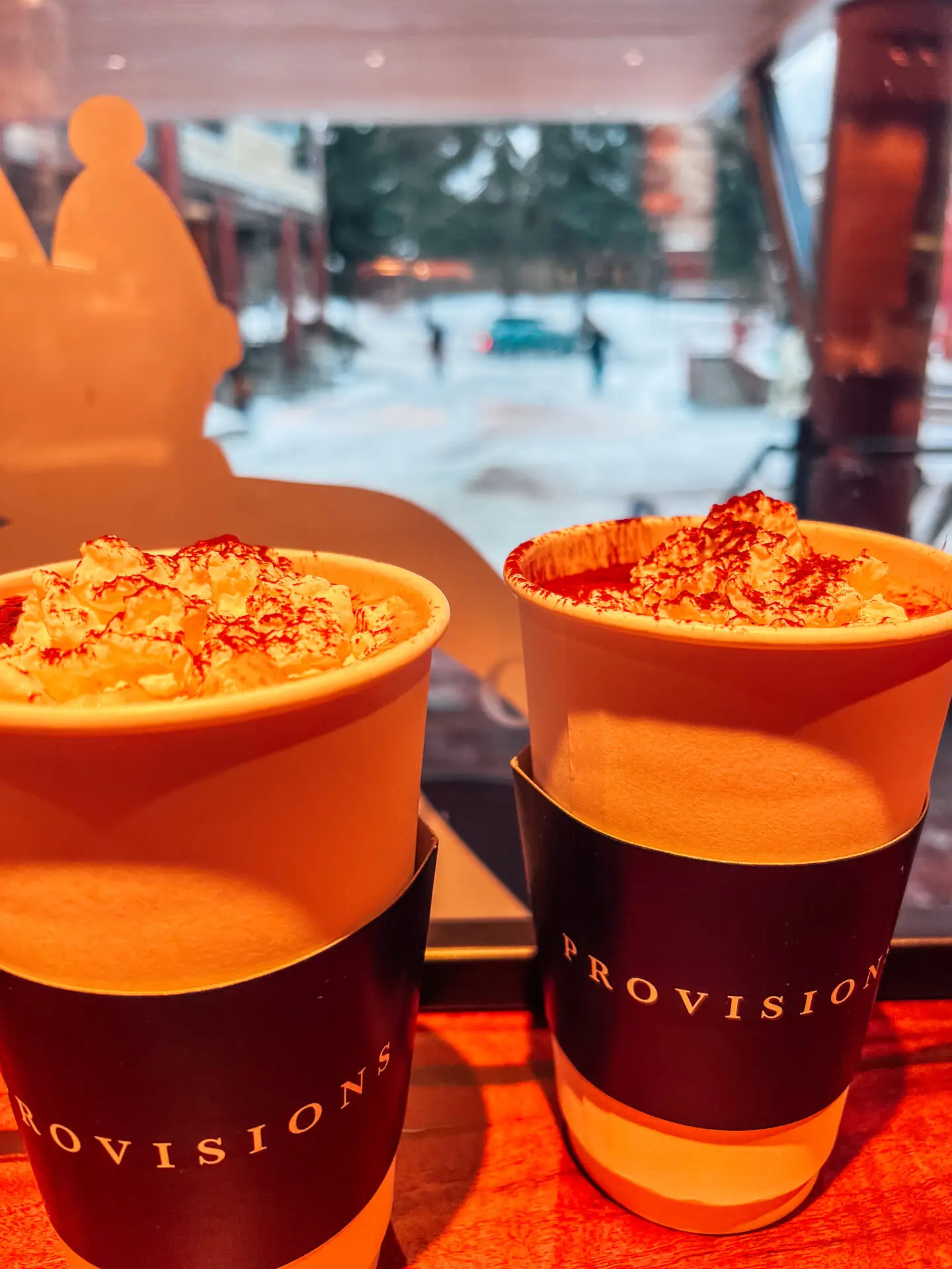 Hot chocolate with whipped cream and a bacon and egg roll at Provision café in Vancouver’s West Village.