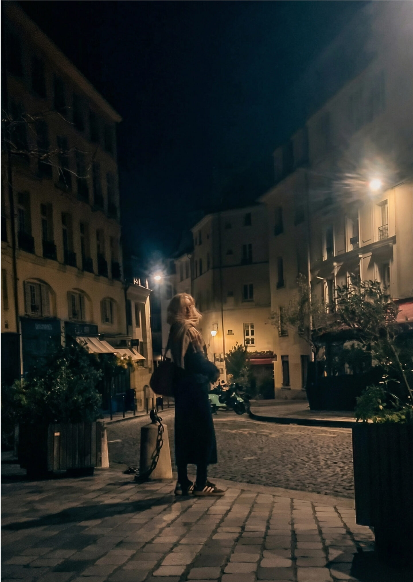 Nicole Waiting at the edge of the street where Gill once did.