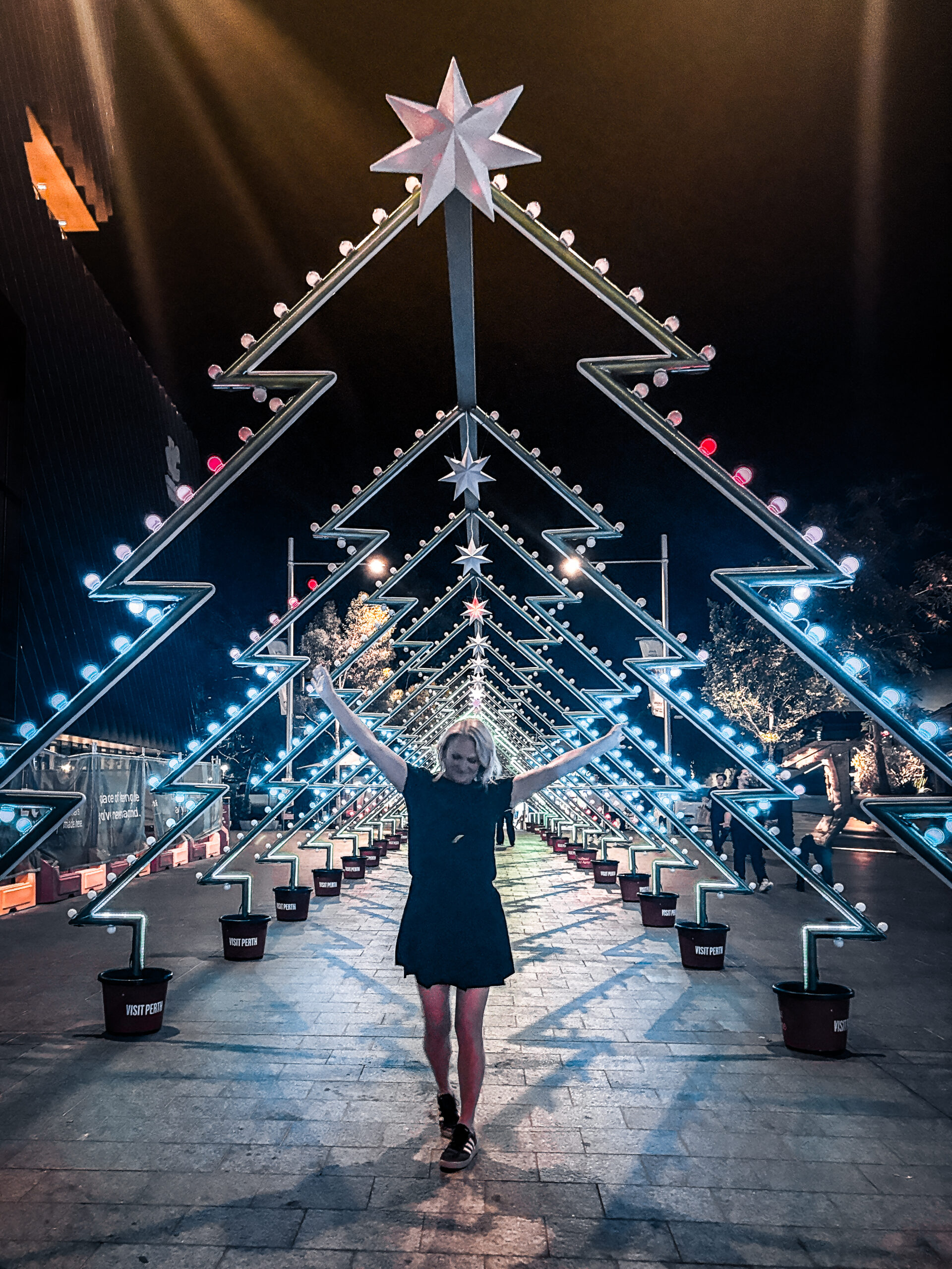 Nicole the influencer surrounded by christmas lights in perth